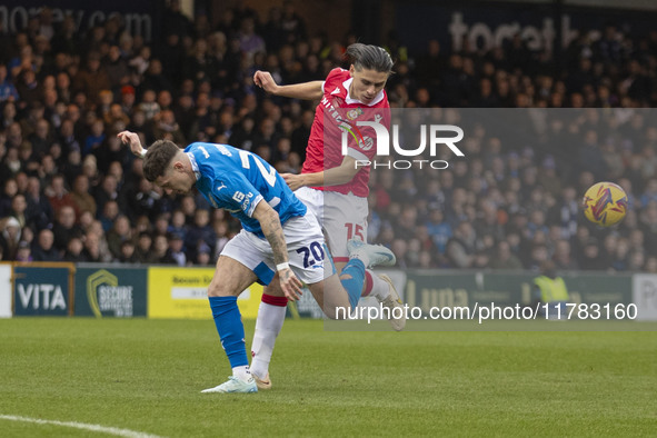 Louie Barry #20 of Stockport County F.C. is challenged by George Dobson #15 of Wrexham A.F.C. during the Sky Bet League 1 match between Stoc...