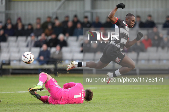 True Grant of Buxton stops a shot from Cedric Main of Darlington during the Isuzu FA Trophy Second round match between Darlington and Buxton...