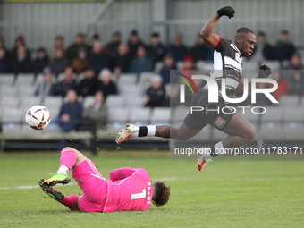 True Grant of Buxton stops a shot from Cedric Main of Darlington during the Isuzu FA Trophy Second round match between Darlington and Buxton...