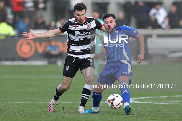 Diego De Girolamo of Buxton is tackled by Toby Lees of Darlington during the Isuzu FA Trophy Second round match between Darlington and Buxto...