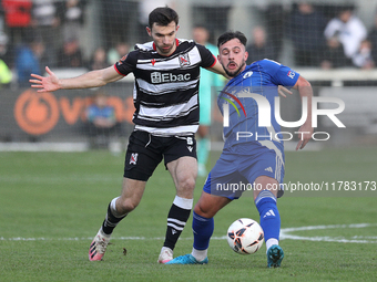 Diego De Girolamo of Buxton is tackled by Toby Lees of Darlington during the Isuzu FA Trophy Second round match between Darlington and Buxto...