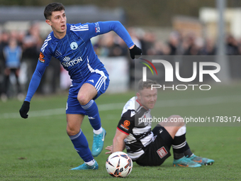 Tom Elliot of Buxton holds off a challenge from Callum Griffiths of Darlington during the Isuzu FA Trophy Second round match between Darling...