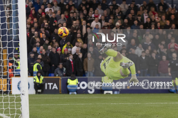 Callum Burton #13 (GK) of Wrexham A.F.C. concedes a goal during the Sky Bet League 1 match between Stockport County and Wrexham at the Edgel...