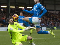 Callum Burton #13 (GK) of Wrexham A.F.C. makes a save during the Sky Bet League 1 match between Stockport County and Wrexham at the Edgeley...