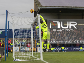 Callum Burton #13 (GK) of Wrexham A.F.C. makes a save during the Sky Bet League 1 match between Stockport County and Wrexham at the Edgeley...