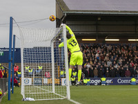 Callum Burton #13 (GK) of Wrexham A.F.C. makes a save during the Sky Bet League 1 match between Stockport County and Wrexham at the Edgeley...