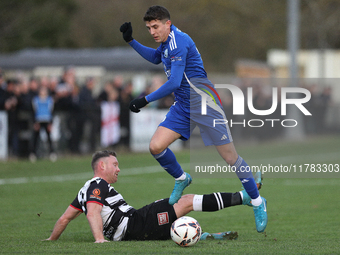 Tom Elliot of Buxton holds off a challenge from Callum Griffiths of Darlington during the Isuzu FA Trophy Second round match between Darling...