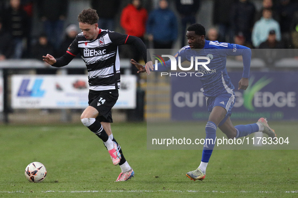 Will Flint of Darlington is challenged by Josh Popoola of Buxton during the Isuzu FA Trophy Second round match between Darlington and Buxton...