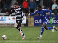 Will Flint of Darlington is challenged by Josh Popoola of Buxton during the Isuzu FA Trophy Second round match between Darlington and Buxton...