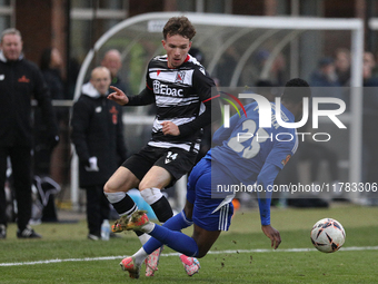 Will Flint of Darlington is challenged by Josh Popoola of Buxton during the Isuzu FA Trophy Second round match between Darlington and Buxton...