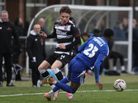 Will Flint of Darlington is challenged by Josh Popoola of Buxton during the Isuzu FA Trophy Second round match between Darlington and Buxton...