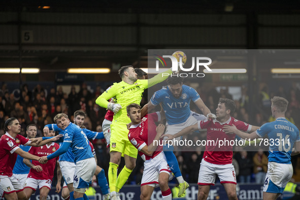 Callum Burton #13 (GK) of Wrexham A.F.C. makes a save during the Sky Bet League 1 match between Stockport County and Wrexham at the Edgeley...