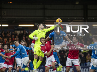 Callum Burton #13 (GK) of Wrexham A.F.C. makes a save during the Sky Bet League 1 match between Stockport County and Wrexham at the Edgeley...