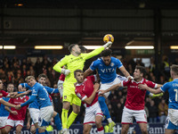 Callum Burton #13 (GK) of Wrexham A.F.C. makes a save during the Sky Bet League 1 match between Stockport County and Wrexham at the Edgeley...