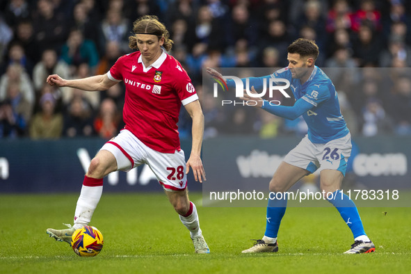 Jon Daoi Boovarsson, number 28 of Wrexham A.F.C., is in possession of the ball during the Sky Bet League 1 match between Stockport County an...