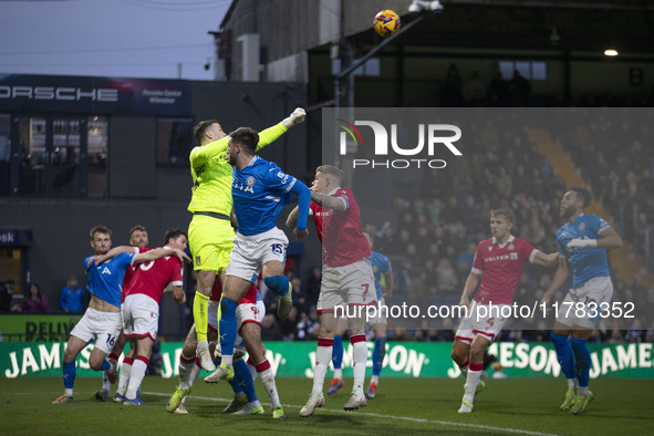 Callum Burton #13 (GK) of Wrexham A.F.C. makes a save during the Sky Bet League 1 match between Stockport County and Wrexham at the Edgeley...