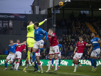 Callum Burton #13 (GK) of Wrexham A.F.C. makes a save during the Sky Bet League 1 match between Stockport County and Wrexham at the Edgeley...