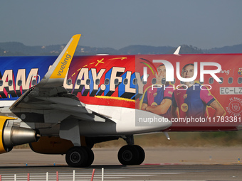 The FC Barcelona women's team launches the Vueling Airbus 320-214 to travel to Madrid with the new livery, featuring images of Aitana Bonmat...