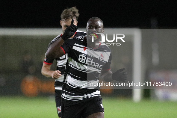 Cedric Main of Darlington scores to make it 1-0 and sends the home team through to the next round during the Isuzu FA Trophy Second round ma...