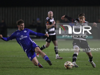 Cian Coleman of Buxton tackles Jarrett Rivers of Darlington during the Isuzu FA Trophy Second round match between Darlington and Buxton at B...