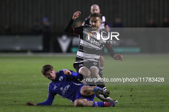 Cian Coleman of Buxton tackles Jarrett Rivers of Darlington during the Isuzu FA Trophy Second round match between Darlington and Buxton at B...