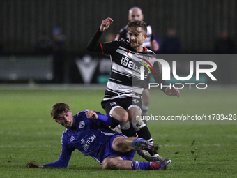 Cian Coleman of Buxton tackles Jarrett Rivers of Darlington during the Isuzu FA Trophy Second round match between Darlington and Buxton at B...