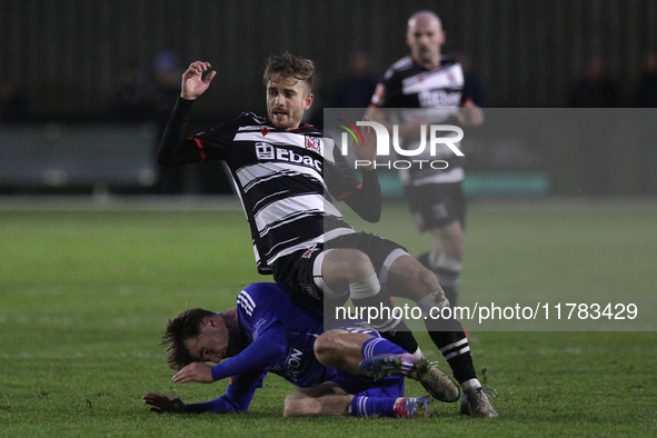 Cian Coleman of Buxton tackles Jarrett Rivers of Darlington during the Isuzu FA Trophy Second round match between Darlington and Buxton at B...