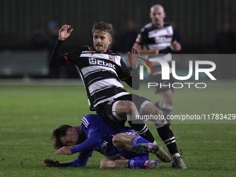 Cian Coleman of Buxton tackles Jarrett Rivers of Darlington during the Isuzu FA Trophy Second round match between Darlington and Buxton at B...