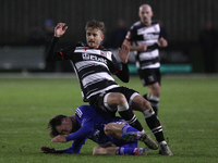 Cian Coleman of Buxton tackles Jarrett Rivers of Darlington during the Isuzu FA Trophy Second round match between Darlington and Buxton at B...