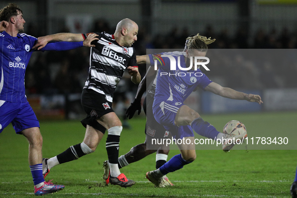 Kieran Burton of Buxton clears the ball during the Isuzu FA Trophy Second round match between Darlington and Buxton at Blackwell Meadows in...