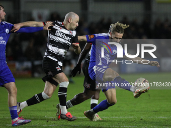 Kieran Burton of Buxton clears the ball during the Isuzu FA Trophy Second round match between Darlington and Buxton at Blackwell Meadows in...