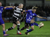 Kieran Burton of Buxton clears the ball during the Isuzu FA Trophy Second round match between Darlington and Buxton at Blackwell Meadows in...