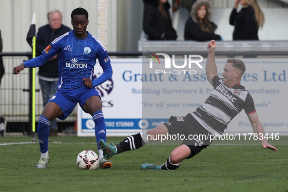 Callum Griffiths of Darlington challenges Josh Popoola of Buxton during the Isuzu FA Trophy Second round match between Darlington and Buxton...