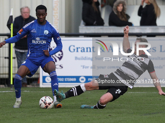 Callum Griffiths of Darlington challenges Josh Popoola of Buxton during the Isuzu FA Trophy Second round match between Darlington and Buxton...