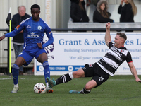 Callum Griffiths of Darlington challenges Josh Popoola of Buxton during the Isuzu FA Trophy Second round match between Darlington and Buxton...