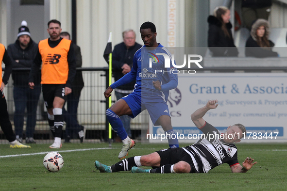 Callum Griffiths of Darlington challenges Josh Popoola of Buxton during the Isuzu FA Trophy Second round match between Darlington and Buxton...