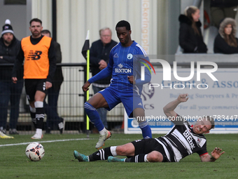 Callum Griffiths of Darlington challenges Josh Popoola of Buxton during the Isuzu FA Trophy Second round match between Darlington and Buxton...