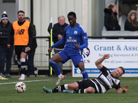 Callum Griffiths of Darlington challenges Josh Popoola of Buxton during the Isuzu FA Trophy Second round match between Darlington and Buxton...