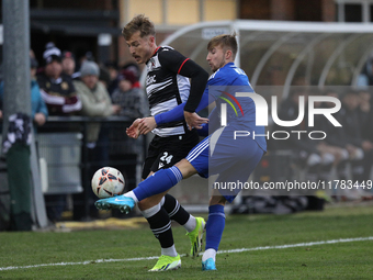 Cameron Salkeld of Darlington is challenged by Josh Williams of Buxton during the Isuzu FA Trophy Second round match between Darlington and...