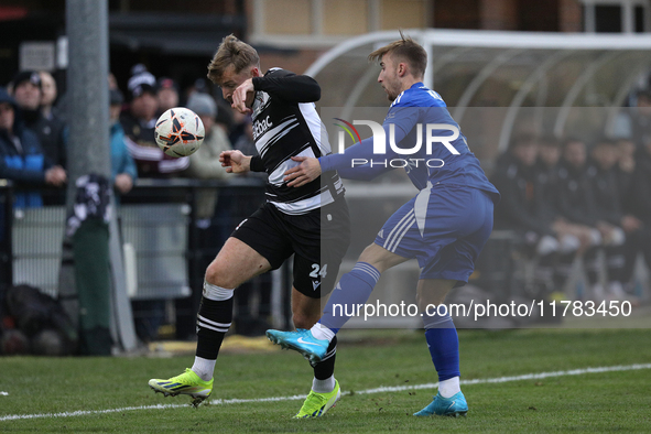 Cameron Salkeld of Darlington is challenged by Josh Williams of Buxton during the Isuzu FA Trophy Second round match between Darlington and...