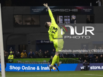 Callum Burton #13 (GK) of Wrexham A.F.C. makes a save during the Sky Bet League 1 match between Stockport County and Wrexham at the Edgeley...