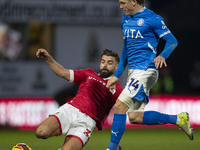 Lewis Brunt #3 of Wrexham A.F.C. challenges Will Collar #14 of Stockport County F.C. during the Sky Bet League 1 match between Stockport Cou...