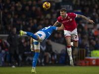 Dan Scarr, number 24 of Wrexham A.F.C., heads the ball during the Sky Bet League 1 match between Stockport County and Wrexham at the Edgeley...