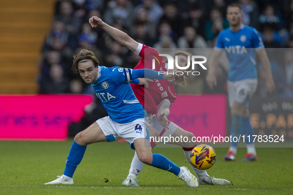 Lewis Bate #4 of Stockport County F.C. is challenged by the opponent during the Sky Bet League 1 match between Stockport County and Wrexham...