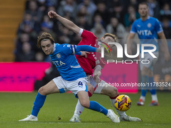 Lewis Bate #4 of Stockport County F.C. is challenged by the opponent during the Sky Bet League 1 match between Stockport County and Wrexham...