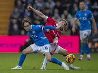 Lewis Bate #4 of Stockport County F.C. is challenged by the opponent during the Sky Bet League 1 match between Stockport County and Wrexham...