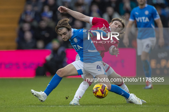 Lewis Bate #4 of Stockport County F.C. is challenged by the opponent during the Sky Bet League 1 match between Stockport County and Wrexham...