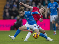 Lewis Bate #4 of Stockport County F.C. is challenged by the opponent during the Sky Bet League 1 match between Stockport County and Wrexham...