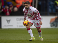 Elliot Lee #38 of Wrexham A.F.C. warms up during the Sky Bet League 1 match between Stockport County and Wrexham at the Edgeley Park Stadium...