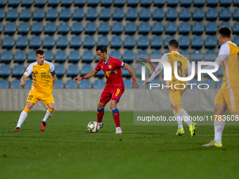 Players are in action during the UEFA Nations League 2024 - League phase - Matchday 4 match between Andorra and Moldova at Estadi Nacional d...